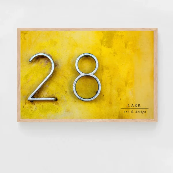 Vintage-Inspired Yellow Wall Decor with 28 Number Accent