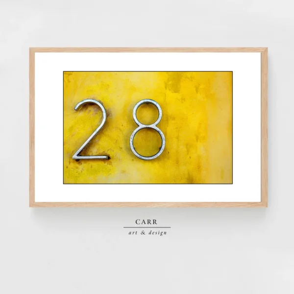 Vintage-Inspired Yellow Wall Decor with 28 Number Accent