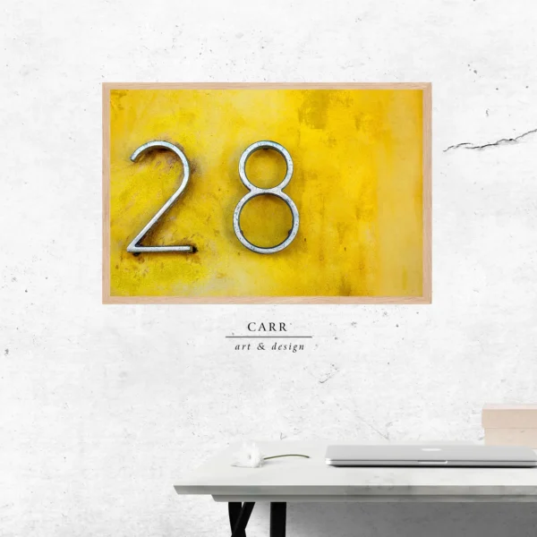 Vintage-Inspired Yellow Wall Decor with 28 Number Accent