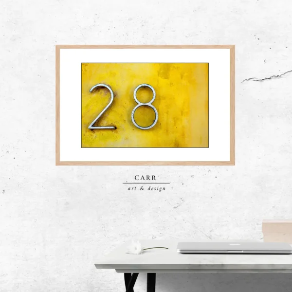 Vintage-Inspired Yellow Wall Decor with 28 Number Accent