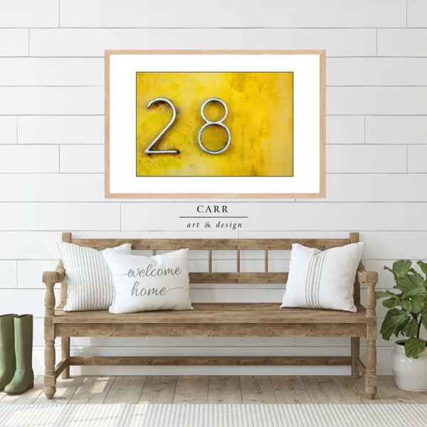 Vintage-Inspired Yellow Wall Decor with 28 Number Accent